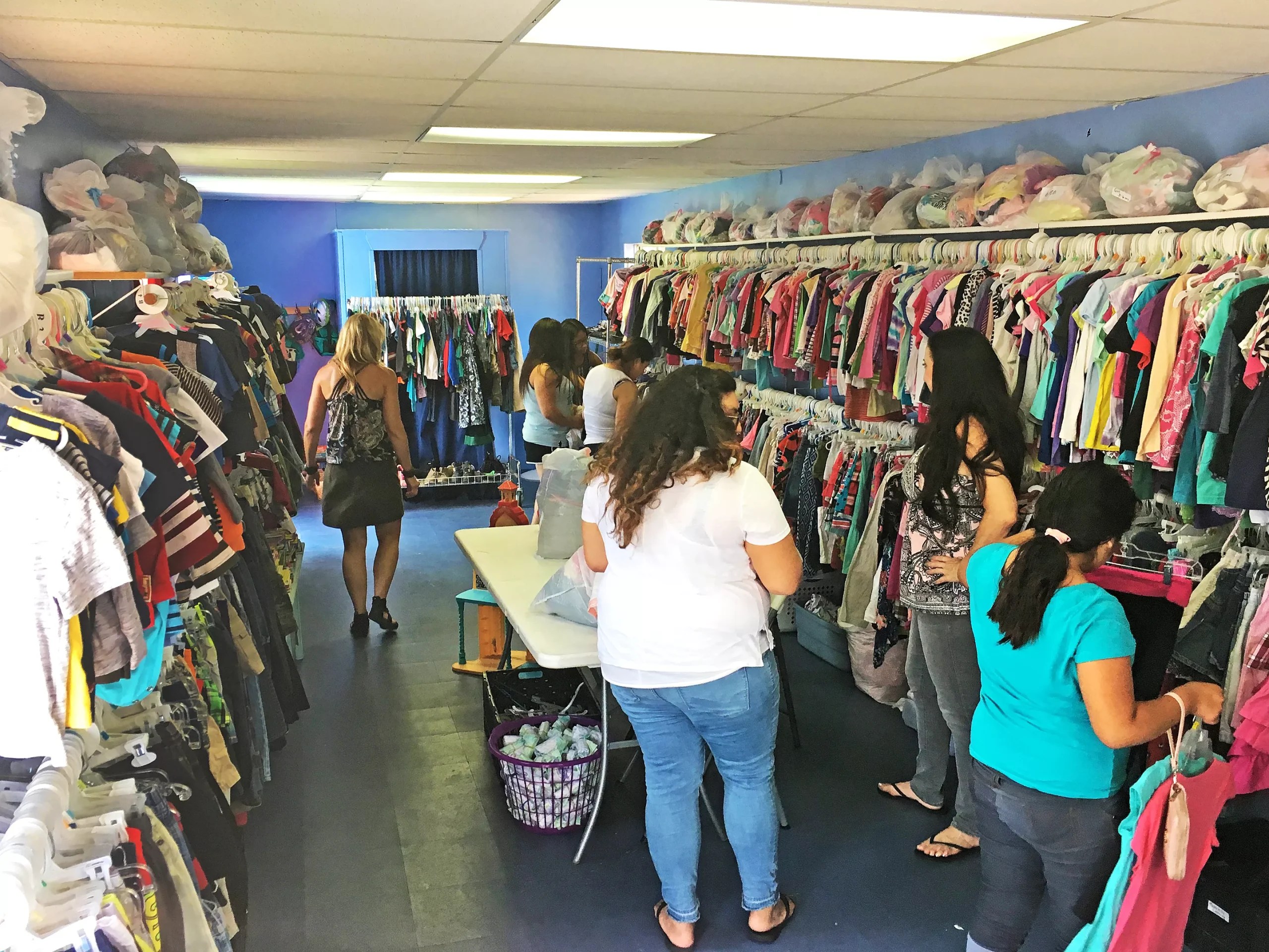 Inside the Children's Closet in Arroyo Grande - shelves stocked with clothing, backpacks, and school supplies for children in need